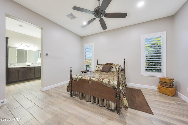 13236 W Montansoro Ln, Peoria, AZ 85383 - bedroom with baseboards, light wood-type flooring, ensuite bathroom, recessed lighting, and a ceiling fan