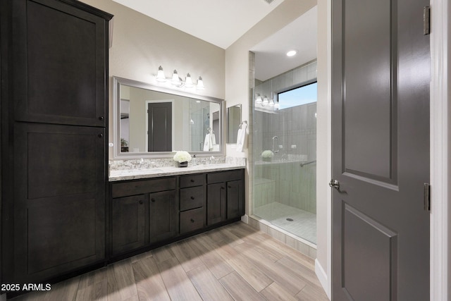 13236 W Montansoro Ln, Peoria, AZ 85383 - full bath with double vanity, a shower stall, and wood finished floors