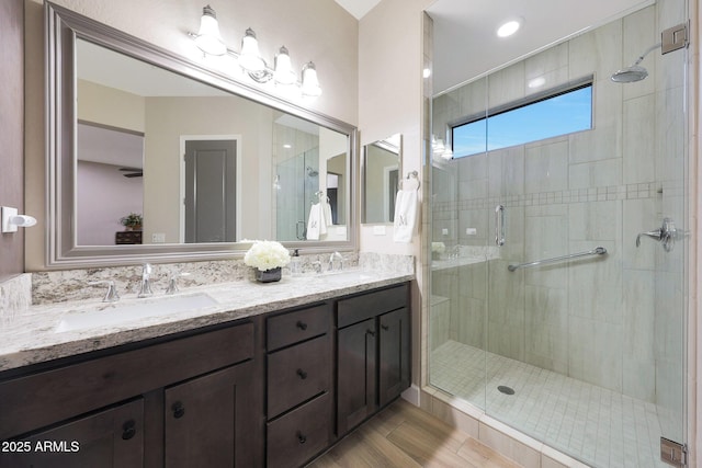 13236 W Montansoro Ln, Peoria, AZ 85383 - full bathroom with a stall shower, double vanity, and wood finished floors