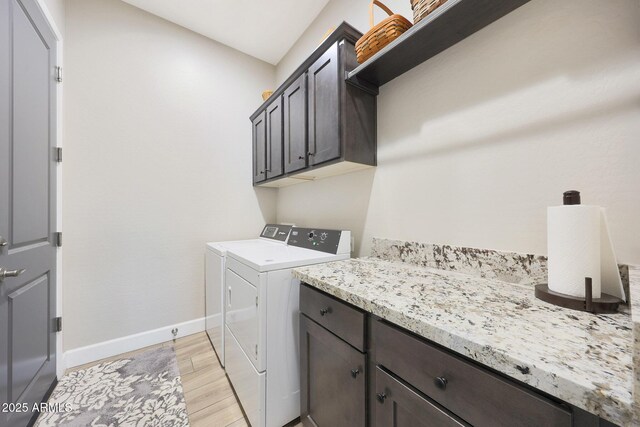 13236 W Montansoro Ln, Peoria, AZ 85383 - washroom with cabinet space, washer and dryer, light wood-style flooring, and baseboards