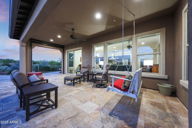 13236 W Montansoro Ln, Peoria, AZ 85383 - patio terrace at dusk with a patio area, a ceiling fan, and an outdoor hangout area