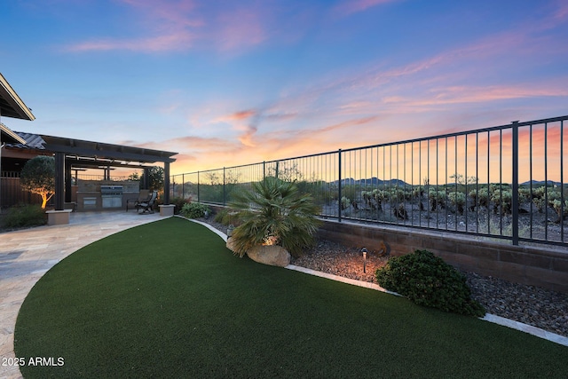 13236 W Montansoro Ln, Peoria, AZ 85383 - view of yard featuring exterior kitchen and a patio area