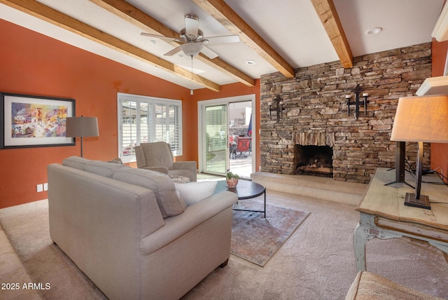 carpeted living room featuring ceiling fan, lofted ceiling with beams, and a fireplace