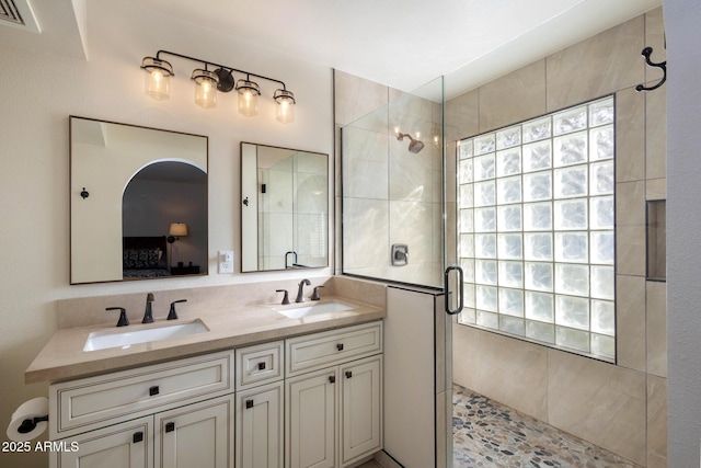 bathroom with vanity and an enclosed shower