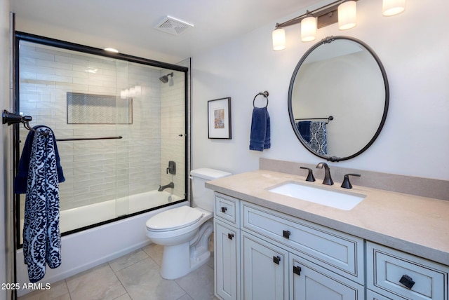 full bathroom with toilet, vanity, tile patterned flooring, and shower / bath combination with glass door