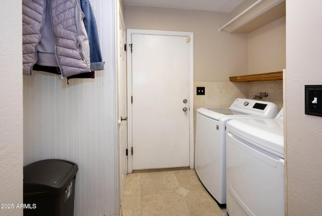 washroom with independent washer and dryer