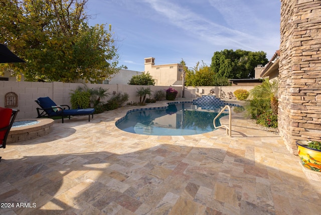 view of swimming pool featuring a patio