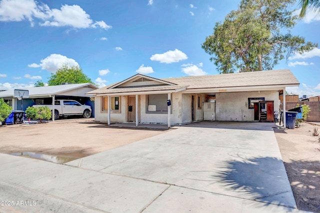 875 E Flint St, Chandler, AZ 85225 - view of front of house featuring concrete driveway, a carport, and covered porch