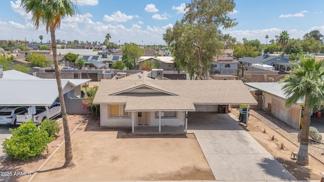 875 E Flint St, Chandler, AZ 85225 - view of front of house featuring a residential view, concrete driveway, roof with shingles, and an attached carport