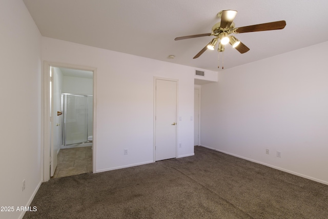 6942 S Championship Dr, Chandler, AZ 85249 - unfurnished bedroom with carpet flooring, ensuite bath, baseboards, and ceiling fan