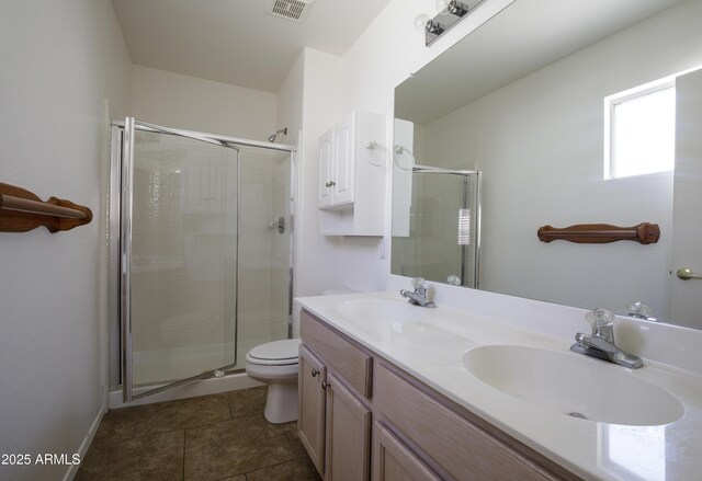 6942 S Championship Dr, Chandler, AZ 85249 - bathroom featuring a shower stall, toilet, double vanity, and tile patterned floors