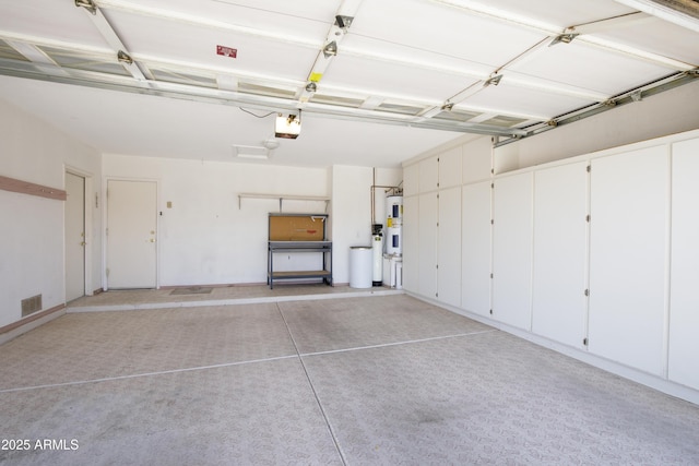 6942 S Championship Dr, Chandler, AZ 85249 - garage with electric water heater and a garage door opener