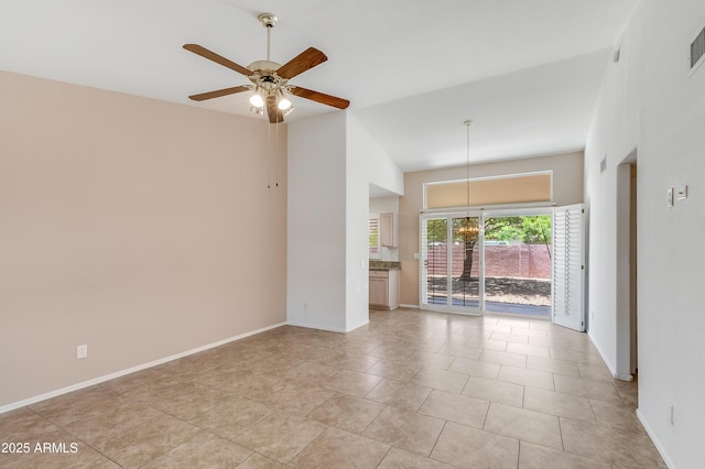 6942 S Championship Dr, Chandler, AZ 85249 - unfurnished room featuring a ceiling fan, baseboards, light tile patterned floors, and a chandelier