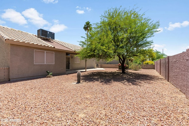 6942 S Championship Dr, Chandler, AZ 85249 - fenced backyard featuring cooling unit and a patio area