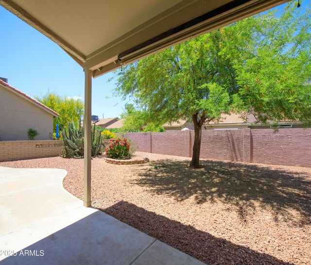 6942 S Championship Dr, Chandler, AZ 85249 - fenced backyard featuring a patio