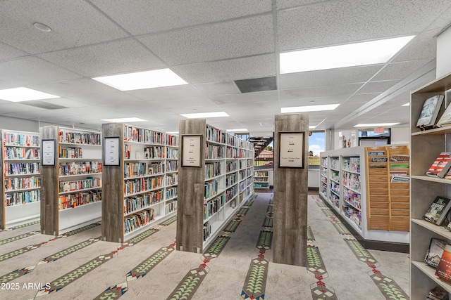 6942 S Championship Dr, Chandler, AZ 85249 - miscellaneous room with wall of books and a paneled ceiling