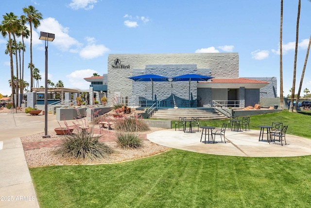 6942 S Championship Dr, Chandler, AZ 85249 - view of home's community featuring a lawn and a patio