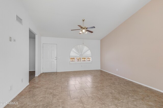 6942 S Championship Dr, Chandler, AZ 85249 - empty room with ceiling fan, baseboards, light tile patterned floors, and lofted ceiling