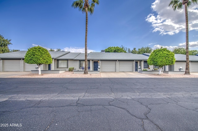 view of front of home featuring an attached garage and concrete driveway