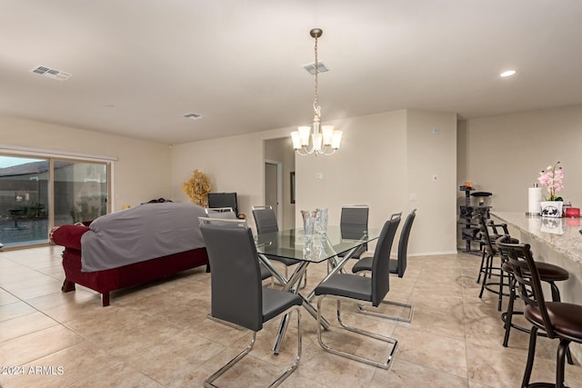 dining space featuring a notable chandelier