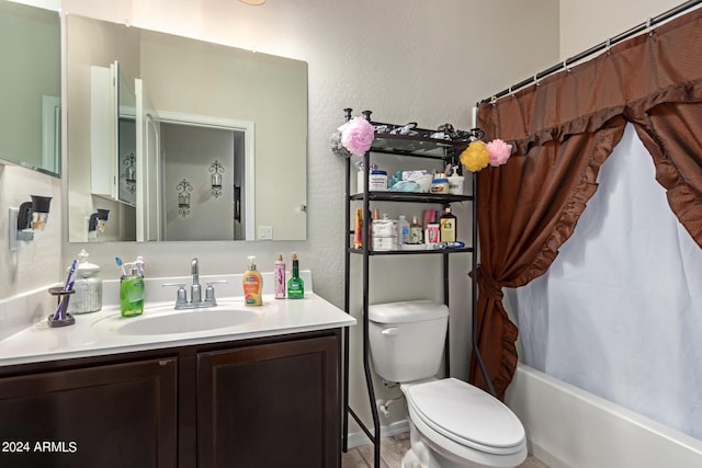 full bathroom featuring shower / tub combo with curtain, vanity, and toilet