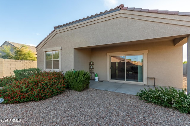 rear view of property featuring a patio area