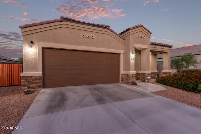 mediterranean / spanish-style house featuring a garage