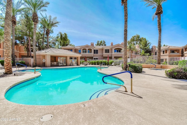 view of swimming pool featuring a patio area