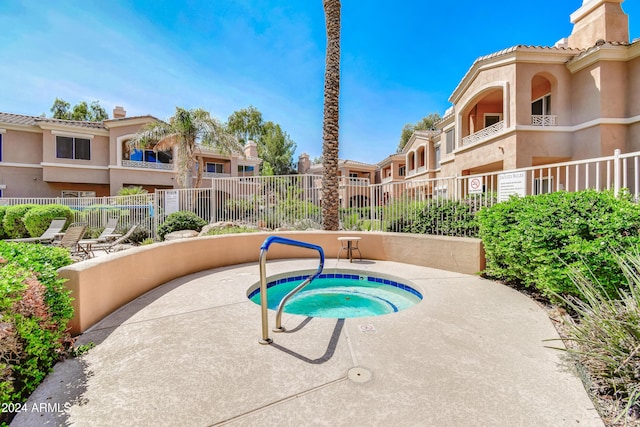 view of pool featuring a community hot tub