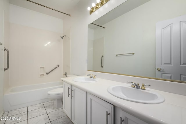 full bathroom featuring a sink, bathtub / shower combination, toilet, and marble finish floor