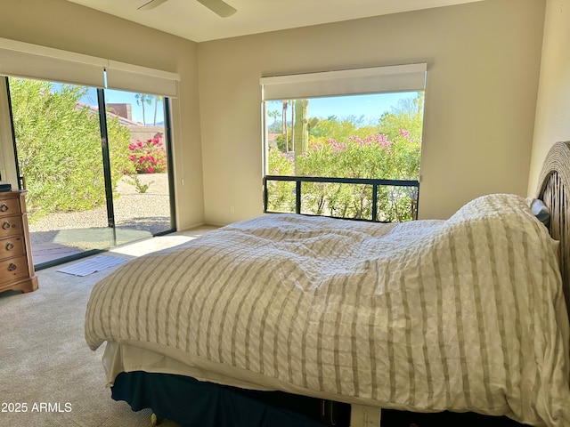 bedroom featuring ceiling fan, access to exterior, and light carpet