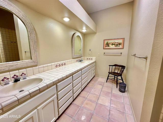 bathroom with vanity and tile patterned floors