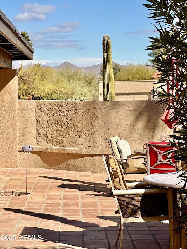 view of patio / terrace with a mountain view