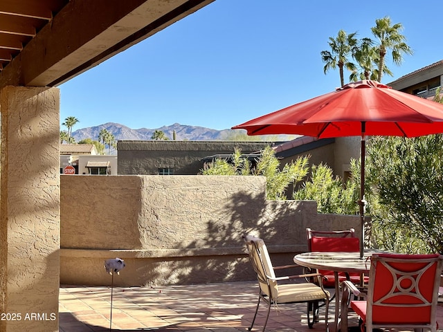 view of patio / terrace featuring a mountain view