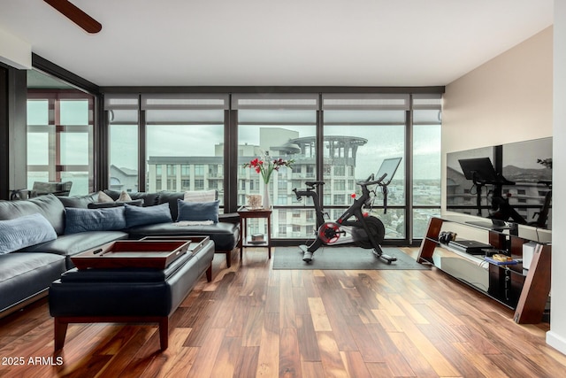 living area featuring expansive windows and wood finished floors