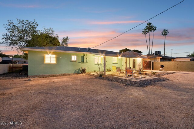 805 E Jackson Ave, Buckeye, AZ 85326 - view of front of house with a patio area and concrete block siding