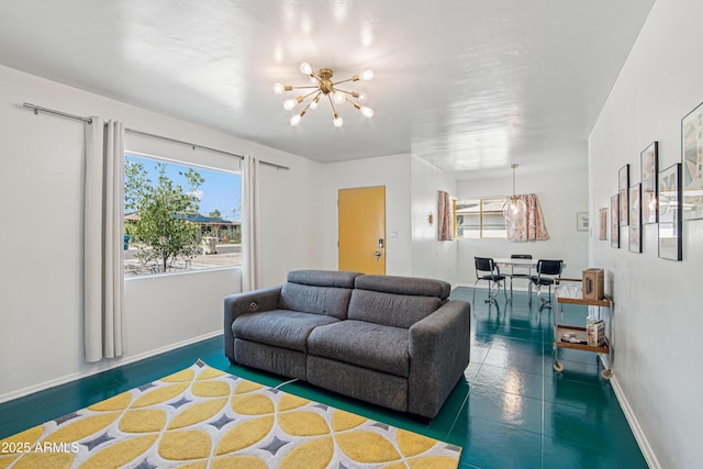 805 E Jackson Ave, Buckeye, AZ 85326 - living area with a chandelier, healthy amount of natural light, baseboards, and tile patterned floors