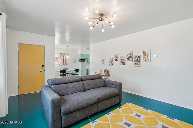 805 E Jackson Ave, Buckeye, AZ 85326 - tiled living room featuring a chandelier and baseboards