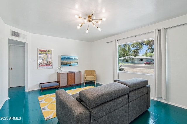 805 E Jackson Ave, Buckeye, AZ 85326 - living area featuring a chandelier and baseboards