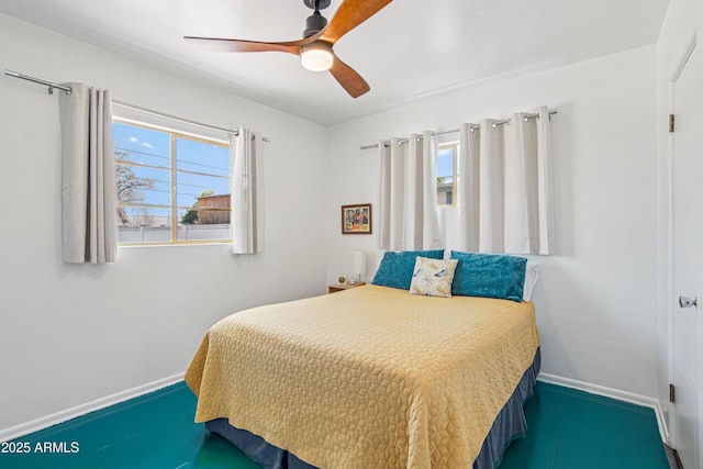 805 E Jackson Ave, Buckeye, AZ 85326 - bedroom featuring baseboards and ceiling fan
