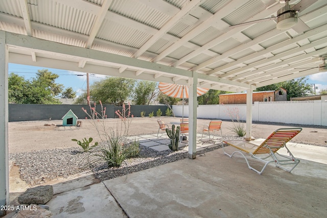 805 E Jackson Ave, Buckeye, AZ 85326 - fenced backyard with a patio area and a ceiling fan