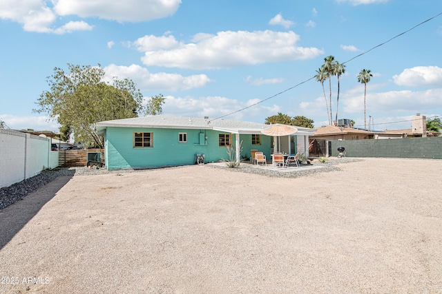 805 E Jackson Ave, Buckeye, AZ 85326 - rear view of house featuring a fenced backyard and a patio