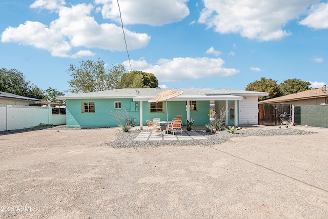 805 E Jackson Ave, Buckeye, AZ 85326 - rear view of house with a patio