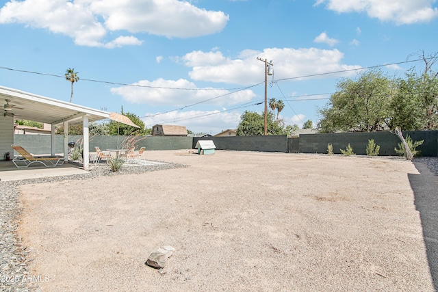 805 E Jackson Ave, Buckeye, AZ 85326 - fenced backyard featuring a patio