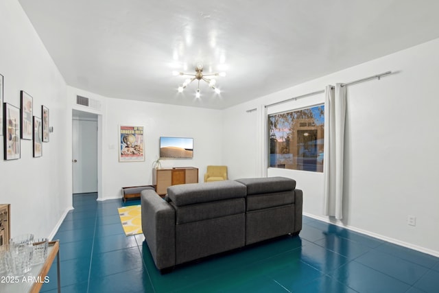 805 E Jackson Ave, Buckeye, AZ 85326 - living room with a chandelier, dark tile patterned flooring, and baseboards