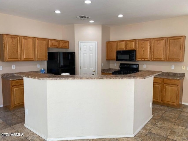 kitchen featuring a center island and black appliances