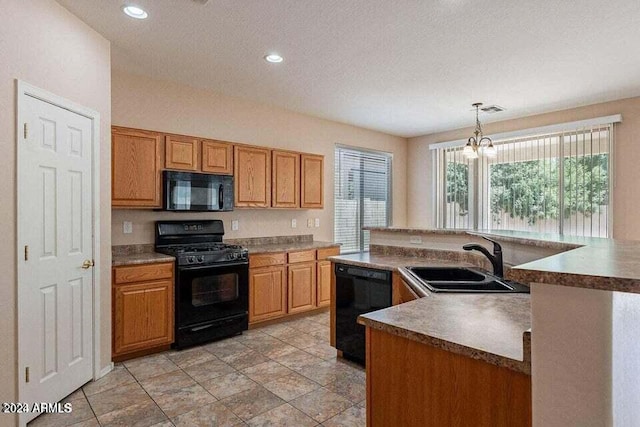 kitchen featuring sink, hanging light fixtures, a chandelier, a textured ceiling, and black appliances