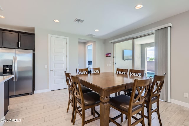 dining space with recessed lighting, light wood-style flooring, baseboards, and visible vents