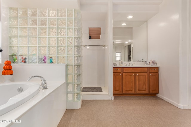 bathroom featuring tile patterned floors, vanity, and independent shower and bath