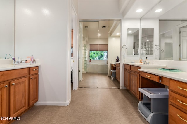 bathroom featuring tile patterned floors and vanity